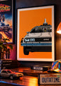 Framed DeLorean time machine art print in an 1980s-inspired display