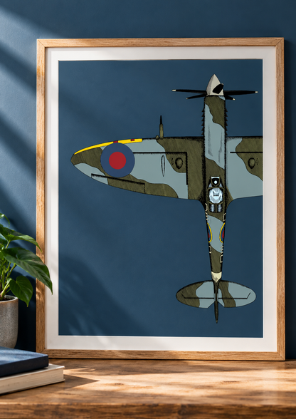 Framed A3 Spitfire fighter plane art print displayed on a blue wall