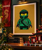 Framed green ninja minifigure art print in a display setting